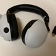 Photo of a Sony Inzone H9 headset and its dongle